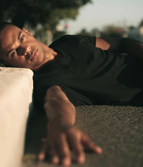 Person stretching peacefully in a modern, calm environment.